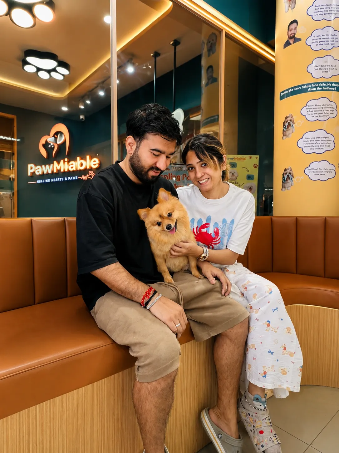 A happy pet parent with their dog at Pawmiable